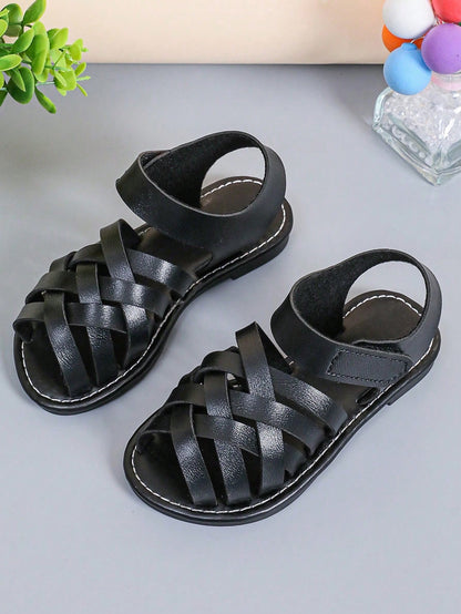 1 Pair Children's Brown Sandals, Solid Color PU Criss-Cross Woven Straps, Buckle Closure, Round Toe Open Toe Flat Non-Slip Fashion Cute Roman Sandals, Suitable For 3-12 Years Old Boys And Girls, Daily